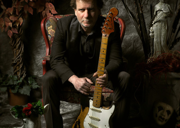 Drew Nelson seated with Stratocaster Portrait by Derek R. Audette